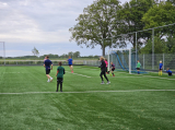 Laatste training S.K.N.W.K. JO11-1JM (partijtje tegen de ouders) van maandag 27 mei 2024 (17/137)